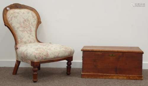 Victorian walnut framed nursing chair carved with stylised floral decoration,