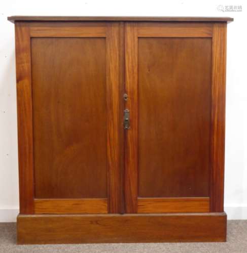 Victorian mahogany cupboard, rectangular moulded top above two paneled doors, revealing two shelves,