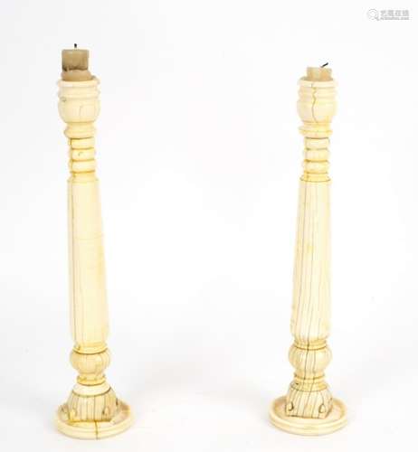 A pair of Anglo-Indian ivory candlesticks made from parts of an 18th Century howdah,