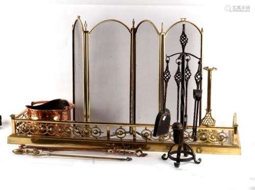 A pierced brass fire curb, a brass and wire mesh fire screen, various fire irons etc.