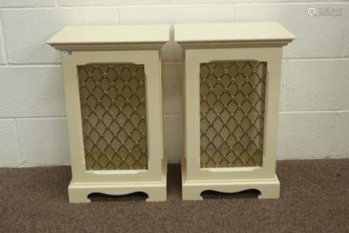 Pair of white painted speaker cabinets, projecting cornice, brass grill decorated with flower heads,