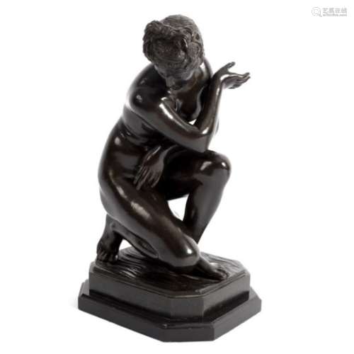 A bronze figure of a nude, on a rectangular stepped base,