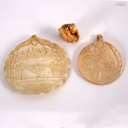 Two Jerusalem mother-of-pearl carvings, one depicting the Virgin and Child,
