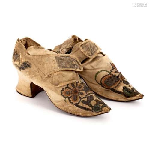 A pair of 17th Century silk court shoes with leather soles,