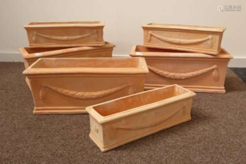 Three sets of two 'terracotta trough' rectangular planters, decorated with wheat swags, 62cm x 25cm,