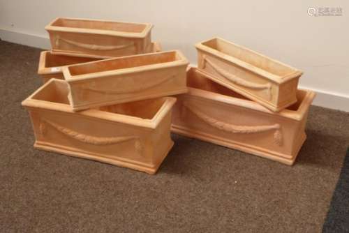 Three sets of two 'terracotta trough' rectangular planters, decorated with wheat swags, 62cm x 25cm,