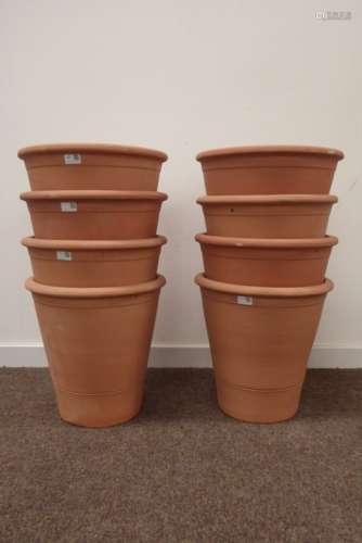 Set eight stackable terracotta tapering plant pots,