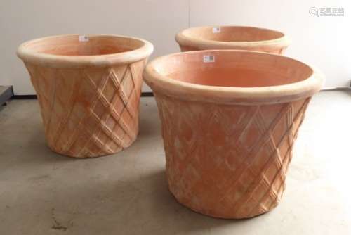 Three terracotta lattice design tapering planters, D50cm,
