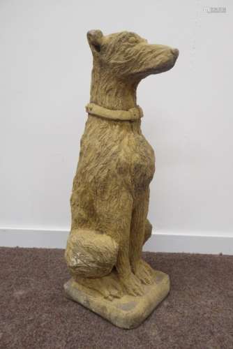 Composite stone garden figure of a seated rough haired hound,