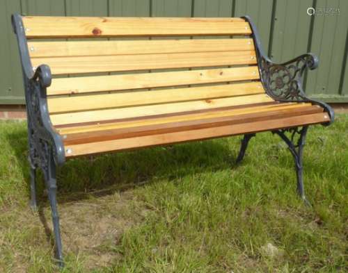 Cast metal garden bench with teak slats,