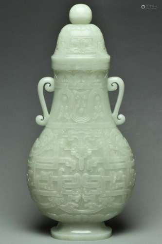 A LARGE QING WHITE JADE ARCHAISTIC VASE 18TH C