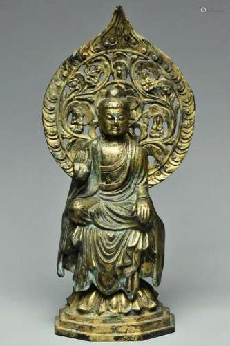 A TANG DYNASTY GILT BRONZE FIGURE OF BUDDHA