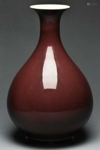 A QING DYNASTY RED GLAZED VASE QIANLONG MARK