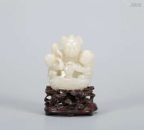A CHINESE JADE FIGURE OF A BOY, QING DYNASTY