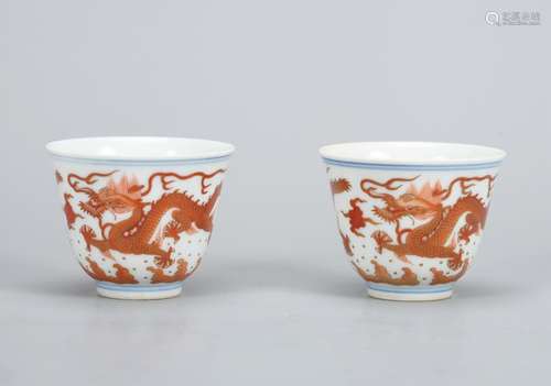 A PAIR OF CHINESE GILT-DECORATED IRON-RED CUPS,