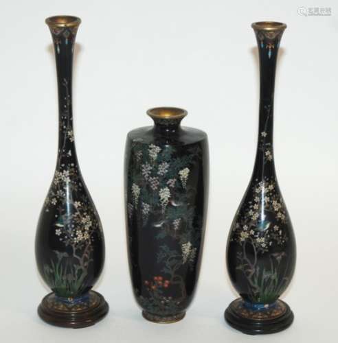 A JAPANESE CLOISONNE BLACK GROUND VASE decorated with birds on wisteria branches, makers mark to