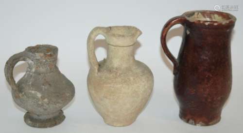 A QUANTITY OF EXCAVATED PRE COLOMBIAN POTTERY SHARDS and three early pottery jugs, 13.5cm, 18cm