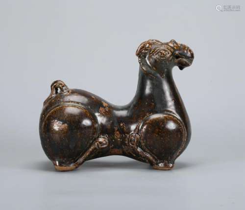 A CHINESE RUSSET-GLAZED RAM,  QING DYNASTY