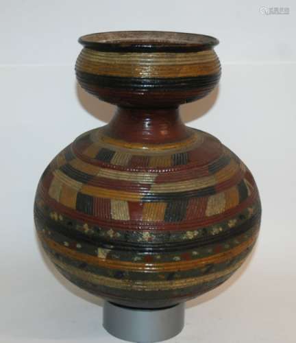 A NIGERIAN POTTERY GOURD SHAPED VESSEL incised and painted with geometric banding in colours, 36cm