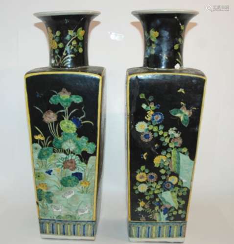 A PAIR OF CHINESE FAMILLE NOIRE SQUARE SHAPED VASES painted with storks amongst aquatic foliage, six