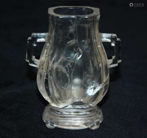 A CHINESE ROCK CRYSTAL BALUSTER VASE carved with blossoming branches, flanked by angular handles and