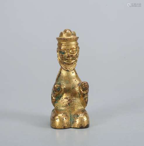 A CHINESE GILT BRONZE FIGURE OF A BARBARIAN, QING