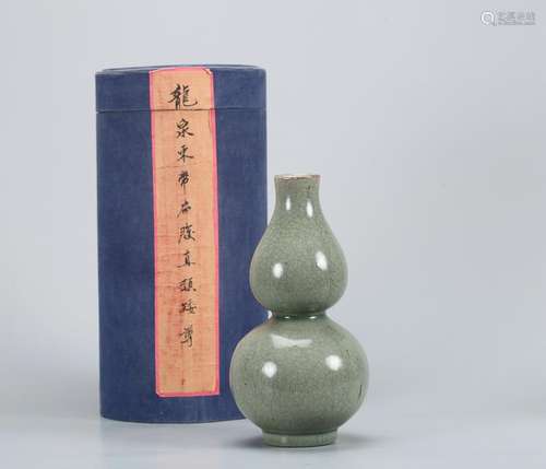 A CHINESE CELADON DOUBLE--GOURD-SHAPED VASE