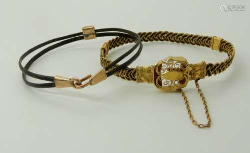 TWO ELEPHANT HAIR BANGLES the first with plaited design twisted wire work and filigree clasp and