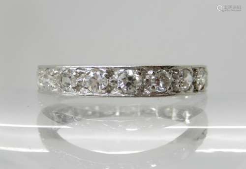 A WHITE METAL FULL DIAMOND ETERNITY RING set with estimated approx 1.14cts of old brilliant cut