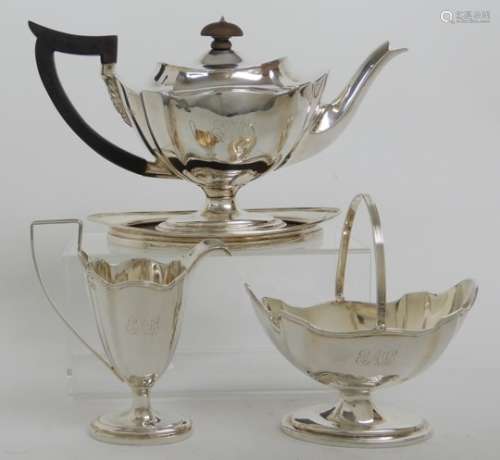 A LATE VICTORIAN FOUR PIECE SILVER TEA SERVICE by Thomas Bradsbury & Sons, London 1897 comprising;