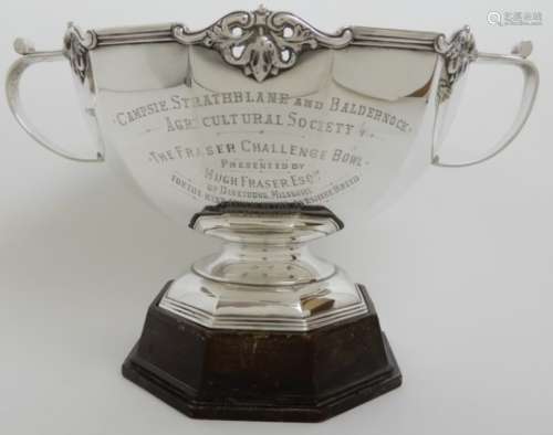 A SILVER TROPHY PUNCH BOWL by Carrington & Company, London 1911, of dodecagon form with six