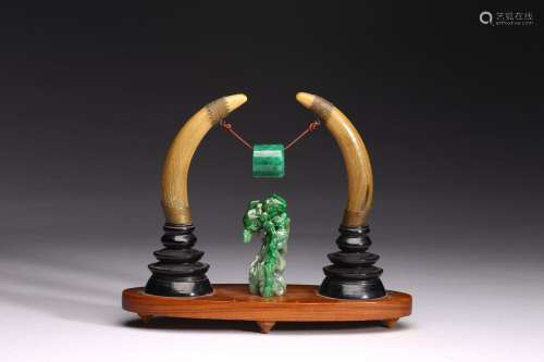 A GROUP OF WALRUS TUSK AND JADEITE CARVINGS