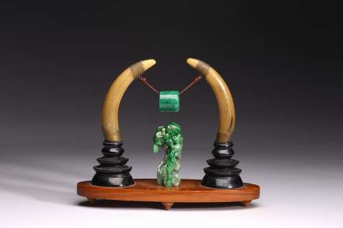 A GROUP OF WALRUS TUSK AND JADEITE CARVINGS