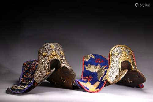 A PAIR OF TWO GILT SILVER DECORATED HORSE SADDLES