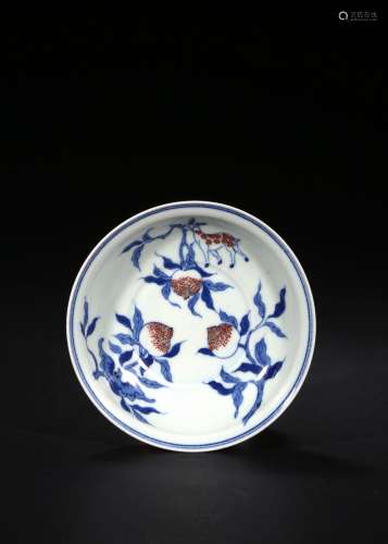 A BLUE AND WHITE RED GLAZED 'PEACH' DISH