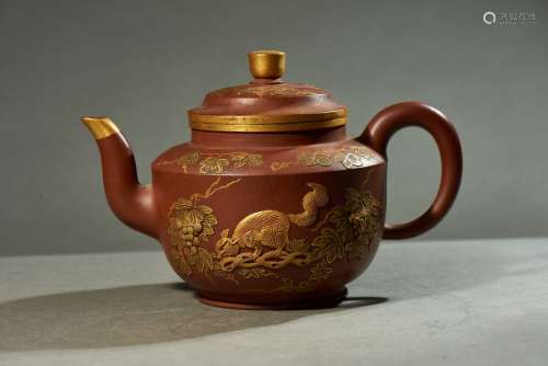 A YIXING MOULDED 'SQUIRRELS' TEAPOT