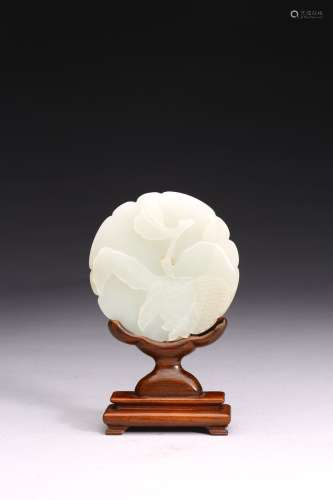 A SMALL WHITE JADE CIRCULAR PLAQUE WITH STAND