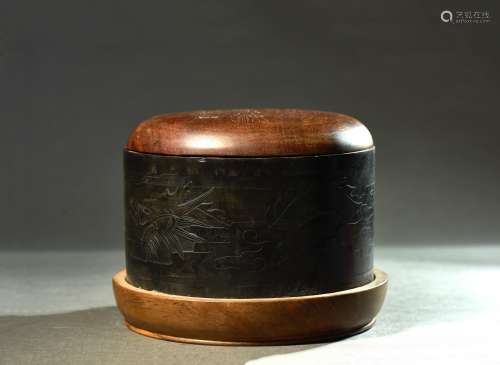 A CIRCULAR INK STONE WITH COVER AND STAND