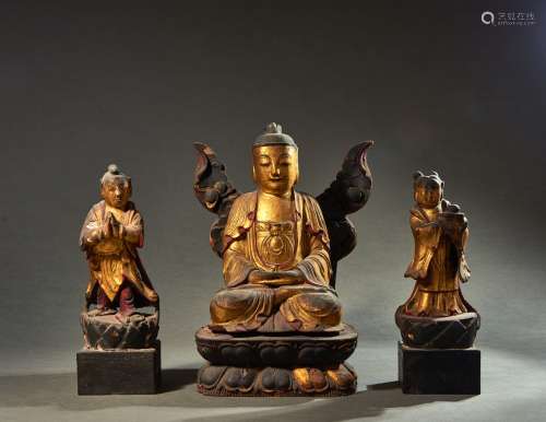 A GROUP OF LACQUER GILT WOOD BUDDHA AND ATTENDANTS