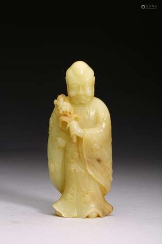 A YELLOW JADE CARVED FIGURE OF LUOHAN