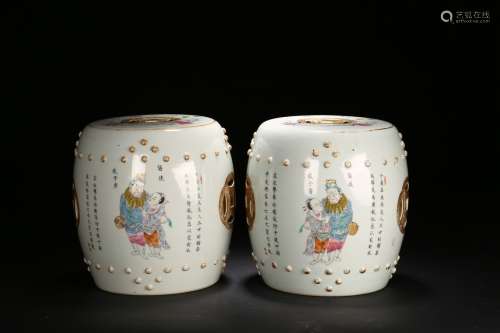 A PAIR OF FAMILLE ROSE 'FIGURES‘ DRUM STOOLS