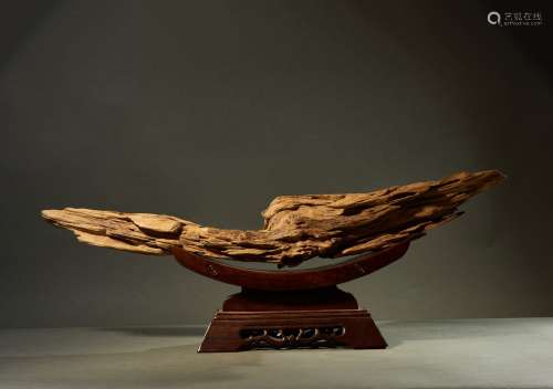 A NATURALISTIC AGARWOOD FORMATION WITH WOOD STAND