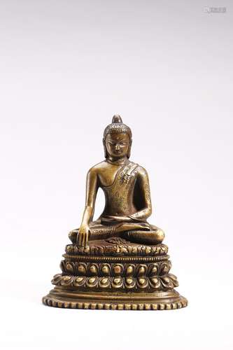 A COPPER ALLOY FIGURE OF SHAKYAMUNI