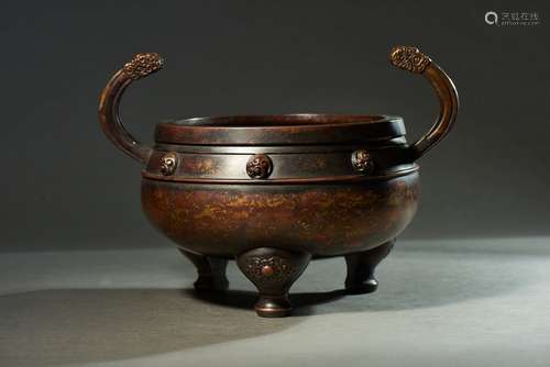 A BRONZE TWO-HANDLED TRIPOD CENSER