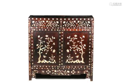 A HARDWOOD MOTHER OF PEARL INLAID CABINET