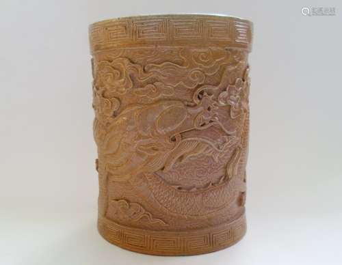 A Chinese Glazed Pottery Brush Pot Decorated With A Carved Dragon