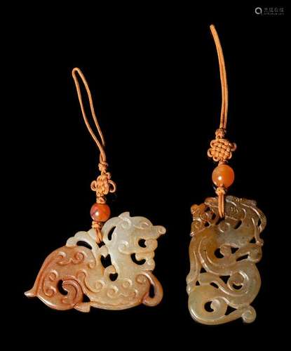 Two Chinese Russet and Celadon 'Dragon' Pendants