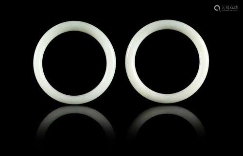 A Pair of Chinese White Hardstone Bangles Each