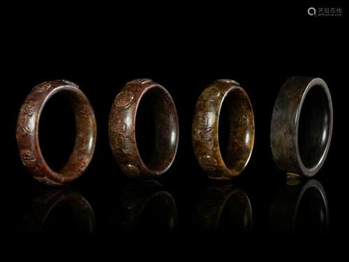 Four Chinese Jade Bangles Largest interior: diam 3 1/2