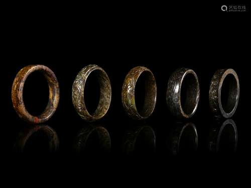 Five Chinese Jade Bangles Largest: diam 3 1/4 in., 8